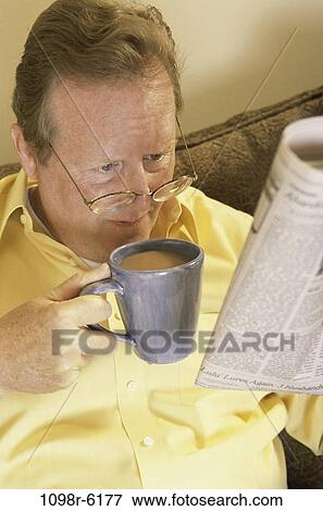 people, newspaper, eyeglasses, coffee, reading, drinking View Large Photo Image Stock Photo - people, newspaper, eyeglasses, coffee, reading, drinking. Fotosearch