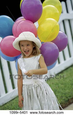 people, party, formal, hat, balloons, laughing, holding View Large Photo Image Stock Image - people, party, formal, hat, balloons, laughing, holding. Fotosearch