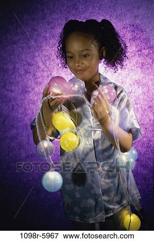 people, party, girl, child, lights, indoors, preparing View Large Photo Image Stock Photo - people, party, girl, child, lights, indoors, preparing. Fotosearch