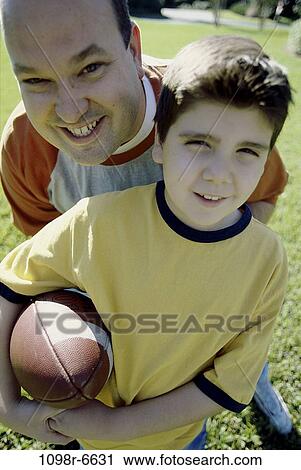 people, playing, ball, football, train, outdoors, sports View Large Photo Image Stock Image - people, playing, ball, football, train, outdoors, sports. Fotosearch