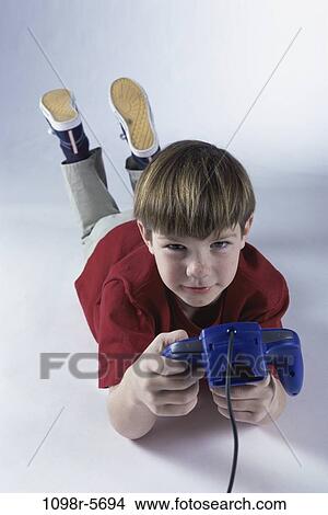 people, playing, boy, child, play, game, brunette View Large Photo Image Picture - people, playing, boy, child, play, game, brunette. Fotosearch