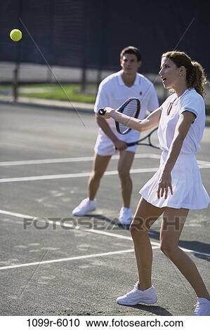 people, playing, couple, ball, tennis, outdoors, sports View Large Photo Image Stock Image - people, playing, couple, ball, tennis, outdoors, sports. Fotosearch