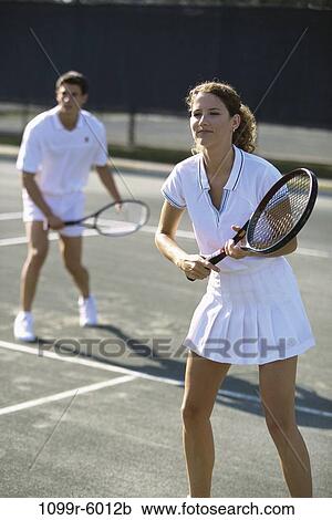 people, playing, couple, tennis, outdoors, sports, teamwork View Large Photo Image Stock Image - people, playing, couple, tennis, outdoors, sports, teamwork. Fotosearch