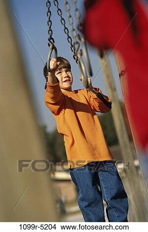 Picture - people, playing, hanging, boy, outdoors, child, play. Fotosearch