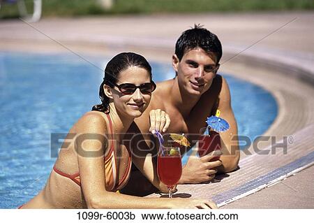 people, pool, couple, drinking, sunglasses, outdoors, vacation View Large Photo Image Stock Image - people, pool, couple, drinking, sunglasses, outdoors, vacation. Fotosearch