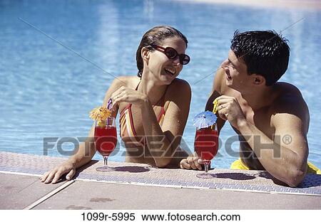 people, pool, couple, drinking, sunglasses, outdoors, beverages View Large Photo Image Stock Photography - people, pool, couple, drinking, sunglasses, outdoors, beverages. Fotosearch
