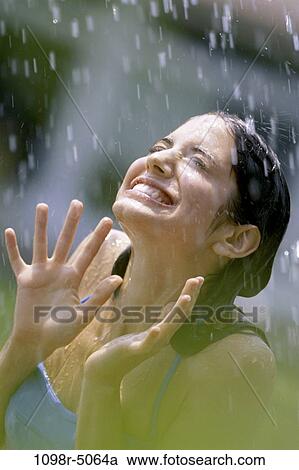 people, rain, outdoors, raining, brunette, teenager View Large Photo Image Stock Image - people, rain, outdoors, raining, brunette, teenager. Fotosearch