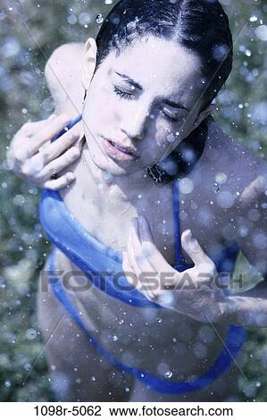 people, rain, standing, outdoors, serious, stand, bikini View Large Photo Image Stock Image - people, rain, standing, outdoors, serious, stand, bikini. Fotosearch