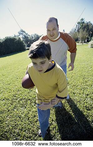 people, running, playing, ball, football, train, outdoors View Large Photo Image Stock Image - people, running, playing, ball, football, train, outdoors. Fotosearch