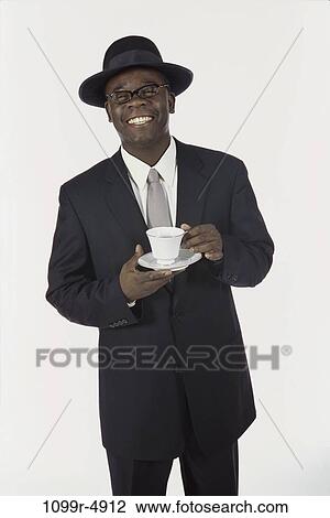 people, smiling, hat, suit, eyeglasses, coffee View Large Photo Image Stock Image - people, smiling, hat, suit, eyeglasses, coffee. Fotosearch