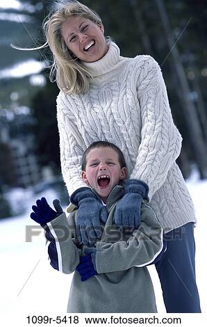 people, snow, mother, winter, outdoors, family, parent View Large Photo Image Stock Photo - people, snow, mother, winter, outdoors, family, parent. Fotosearch