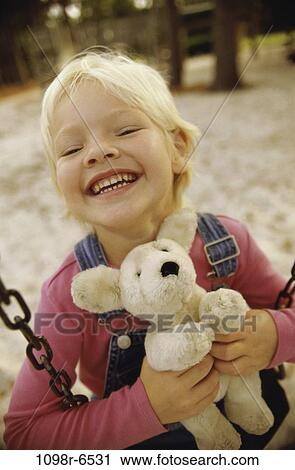 people, stuffed animal, holding, girl, swing, playground, outdoors View Large Photo Image Stock Image - people, stuffed animal, holding, girl, swing, playground, outdoors. Fotosearch