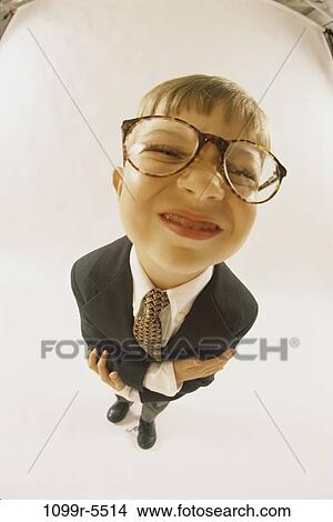 Picture - people, suit, eyeglasses, boy, business, humor, indoors. Fotosearch