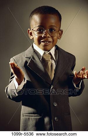 Stock Photograph - people, suit, eyeglasses, boy, business, humor, personification. Fotosearch