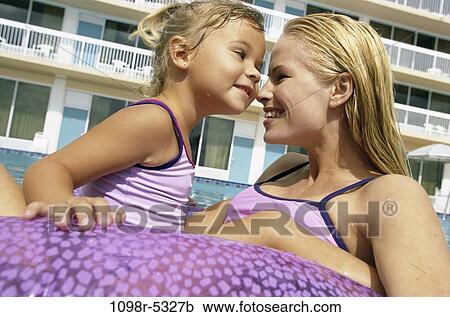 Stock Image - people, swim, floating, pool, mother, swimming, outdoors. Fotosearch