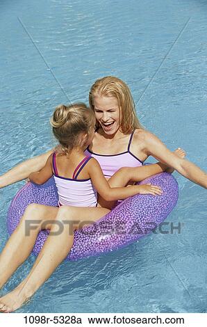 Stock Image - people, swim, floating, pool, mother, swimming, outdoors. Fotosearch