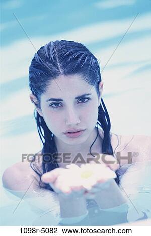 people, swim, water, pool, swimming, holding, flower View Large Photo Image Stock Image - people, swim, water, pool, swimming, holding, flower. Fotosearch