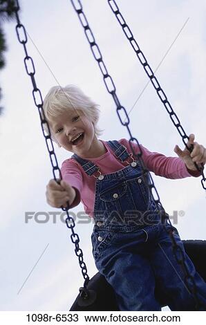 people, swinging, girl, swing, outdoors, child, blond View Large Photo Image Stock Image - people, swinging, girl, swing, outdoors, child, blond. Fotosearch