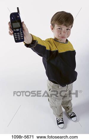 people, telephone, phone, holding, boy, child, brunette View Large Photo Image Stock Image - people, telephone, phone, holding, boy, child, brunette. Fotosearch