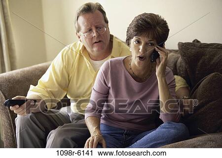 people, telephone, talking, couple, eyeglasses, phone, Middle-aged View Large Photo Image Stock Image - people, telephone, talking, couple, eyeglasses, phone, Middle-aged. Fotosearch