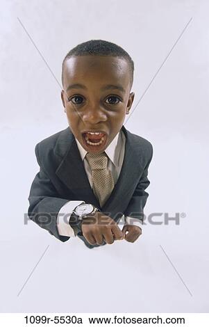 people, time, suit, watch, boy, business, serious View Large Photo Image Stock Image - people, time, suit, watch, boy, business, serious. Fotosearch