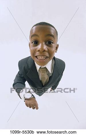 Stock Image - people, time, suit, watch, boy, business, anticipation. Fotosearch