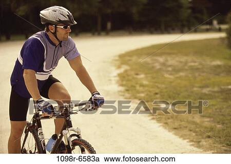 Stock Image - people, track, active, bicycle, helmet. Fotosearch