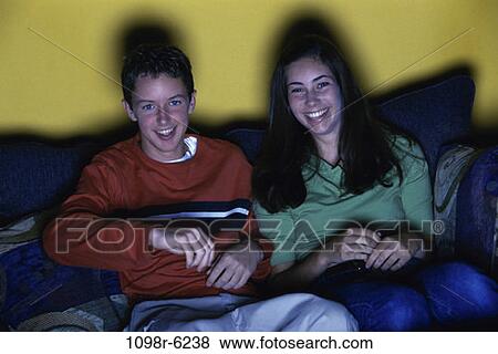 people, watch, couch, watching, television, teens, brunette View Large Photo Image Stock Photo - people, watch, couch, watching, television, teens, brunette. Fotosearch