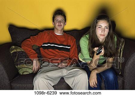people, watch, couch, watching, television, teens, brunette View Large Photo Image Stock Photo - people, watch, couch, watching, television, teens, brunette. Fotosearch