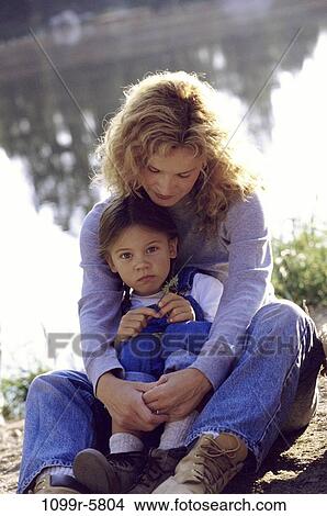 people, water, mother, outdoors, hugging, family, hug View Large Photo Image Picture - people, water, mother, outdoors, hugging, family, hug. Fotosearch