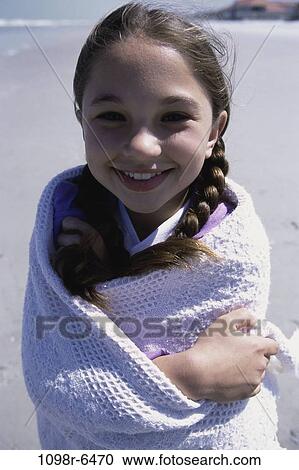 people, water, wrapped, beach, girl, child, brunette View Large Photo Image Stock Image - people, water, wrapped, beach, girl, child, brunette. Fotosearch