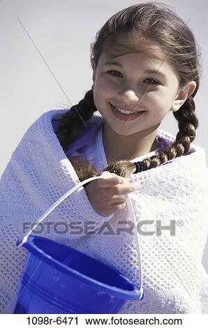 Stock Image - people, water, wrapped, beach, girl, child, brunette. Fotosearch