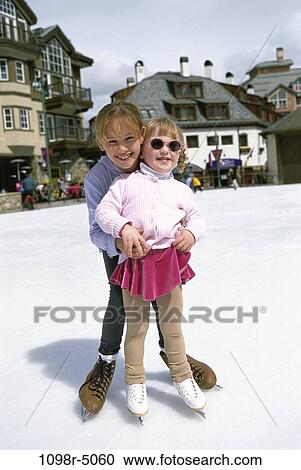 Stock Image - people, winter, sunglasses, outdoors, children, posing, girls. Fotosearch