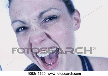 people, woman, angry, mischievous, brunette, indoors, headshot View Large Photo Image Stock Image - people, woman, angry, mischievous, brunette, indoors, headshot. Fotosearch