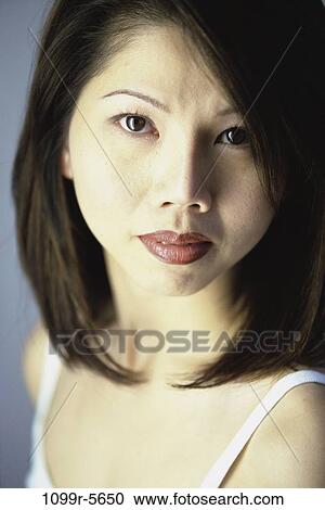people, woman, Asian, brunette, indoors, headshot, young adult View Large Photo Image Stock Image - people, woman, Asian, brunette, indoors, headshot, young adult. Fotosearch