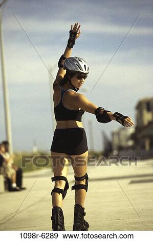 Stock Photo - people, woman, Asian, riding, outdoors, ride, brunette. Fotosearch