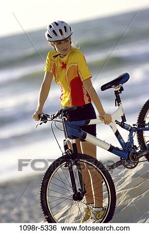 people, woman, beach, outdoors, Middle-aged, bike, cycling View Large Photo Image Stock Photograph - people, woman, beach, outdoors, Middle-aged, bike, cycling. Fotosearch