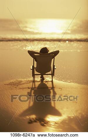 people, woman, beach, relaxing, vacation, sunbathing, suntan View Large Photo Image Stock Image - people, woman, beach, relaxing, vacation, sunbathing, suntan. Fotosearch