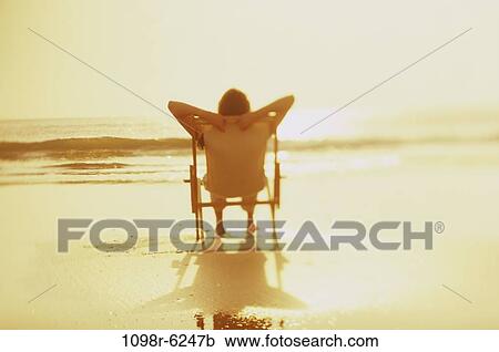people, woman, beach, relaxing, vacation, sunbathing View Large Photo Image Stock Image - people, woman, beach, relaxing, vacation, sunbathing. Fotosearch