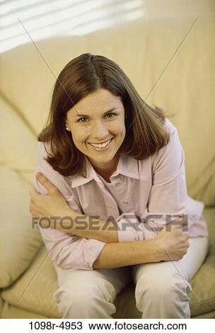Stock Image - people, woman, brunette, indoors, Caucasian, young adult, Young women indoors. Fotosearch