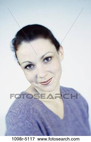 Stock Photo - people, woman, brunette, indoors, Caucasian, young adult, Young women headshots. Fotosearch