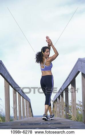 people, woman, clapping, Hispanic, outdoors, exercise, headphone View Large Photo Image Stock Photo - people, woman, clapping, Hispanic, outdoors, exercise, headphone. Fotosearch