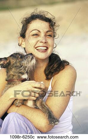 people, woman, dog, puppy, pet, holding, outdoors View Large Photo Image Stock Image - people, woman, dog, puppy, pet, holding, outdoors. Fotosearch