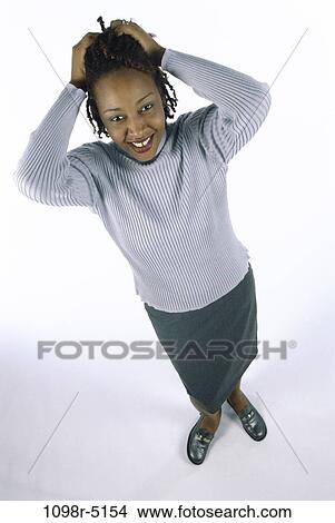 people, woman, frustrated, brunette, indoors, African-American, young adult View Large Photo Image Picture - people, woman, frustrated, brunette, indoors, African-American, young adult. Fotosearch