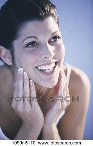 Stock Image - people, woman, Hispanic, beauty, brunette, indoors, facial. Fotosearch