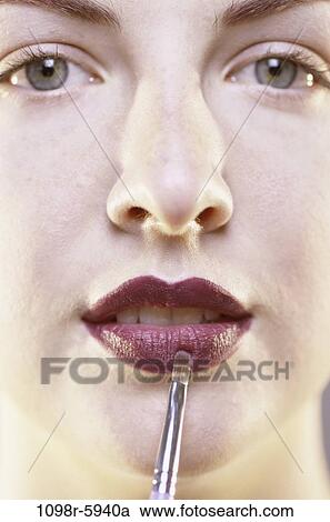 Stock Image - people, woman, makeup, beauty, indoors, Caucasian, young adult. Fotosearch