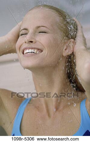 Stock Photograph - people, woman, outdoors, blond, bath, shower, Caucasian. Fotosearch