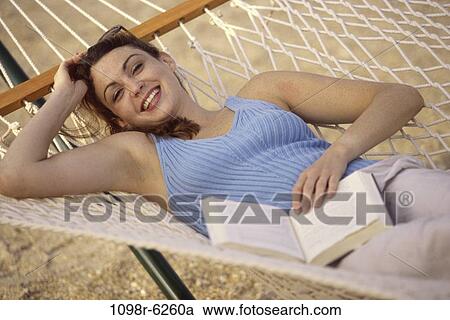 people, woman, reading, hammock, book, outdoors View Large Photo Image Stock Image - people, woman, reading, hammock, book, outdoors. Fotosearch