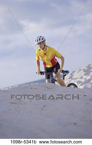 Stock Image - people, woman, riding, mountains, Middle-aged, bike, cycling. Fotosearch