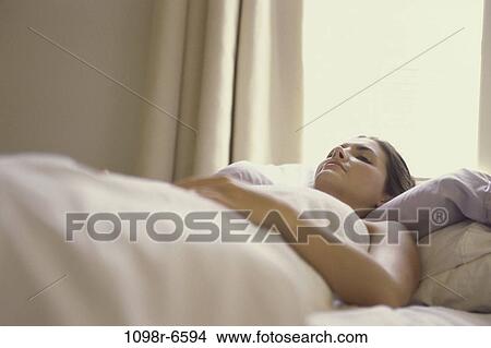 people, woman, sleeping, bed, relaxing, resting View Large Photo Image Picture - people, woman, sleeping, bed, relaxing, resting. Fotosearch